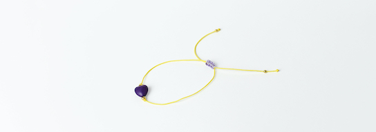 Yellow bracelet with purple heart
